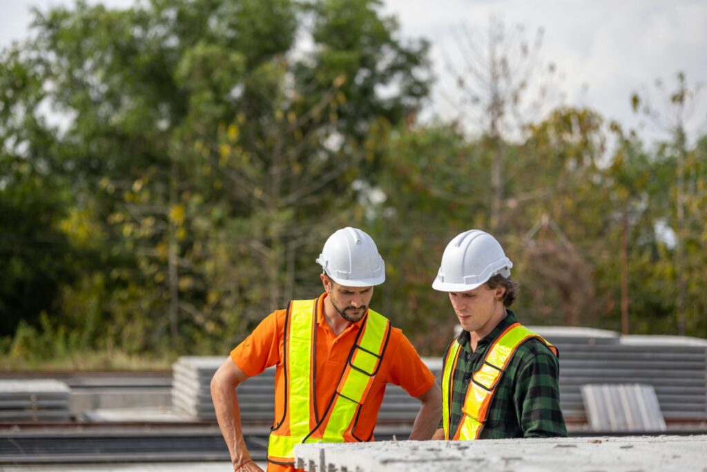 Construction workers reviewing plans at a job site