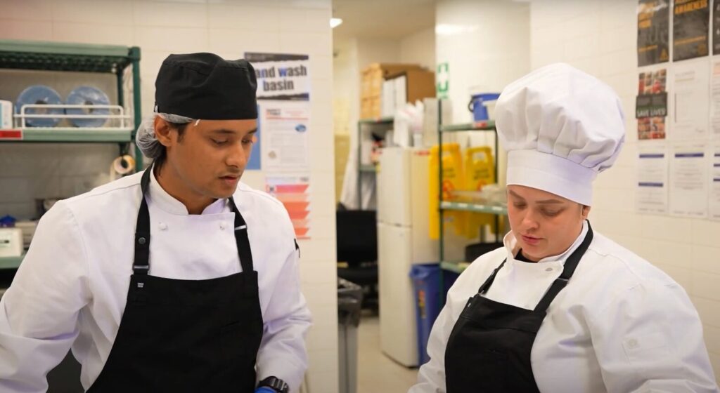 Chefs working together in a commercial kitchen