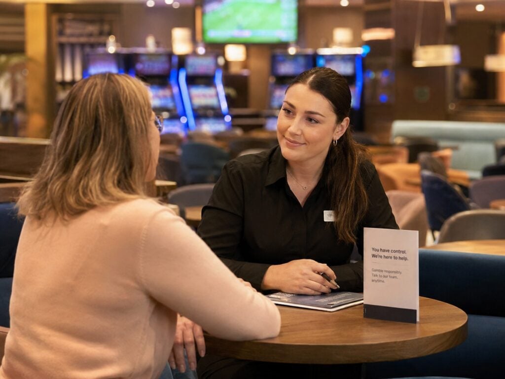 Responsible Gambling Officer Speaking With a Customer